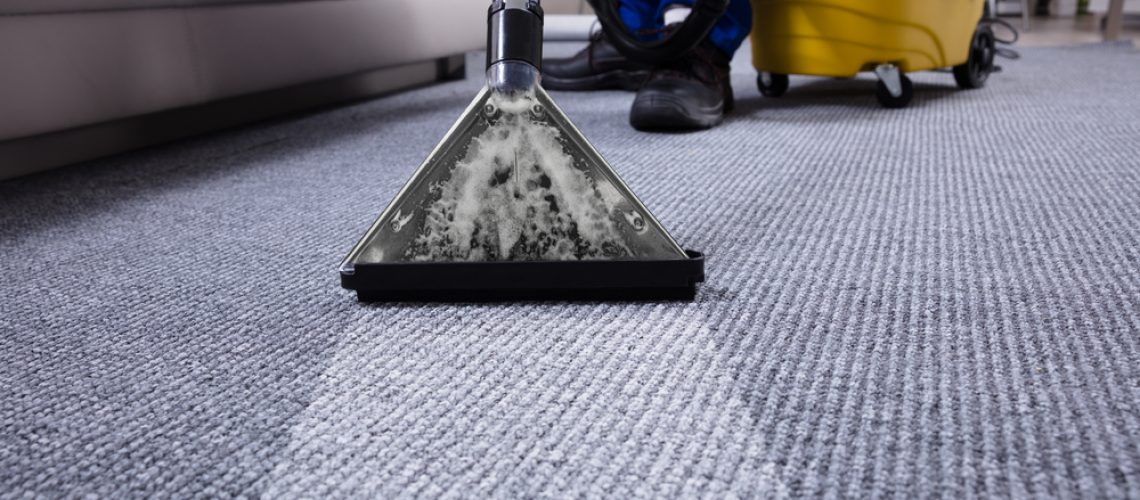janiter doing commercial carpet cleaning